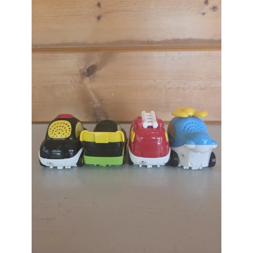 Lot of 4 VTech Go! Go! Smart Wheels Police Car Fire Truck Racecar Helicopter ZB4